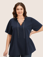 Solid Crisscross Notched Metal Decor Blouse