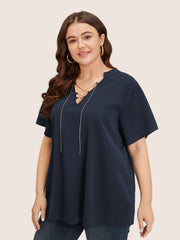 Solid Crisscross Notched Metal Decor Blouse